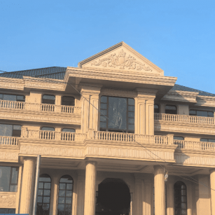 柳州黄金麻别墅外墙干挂石材效果示例